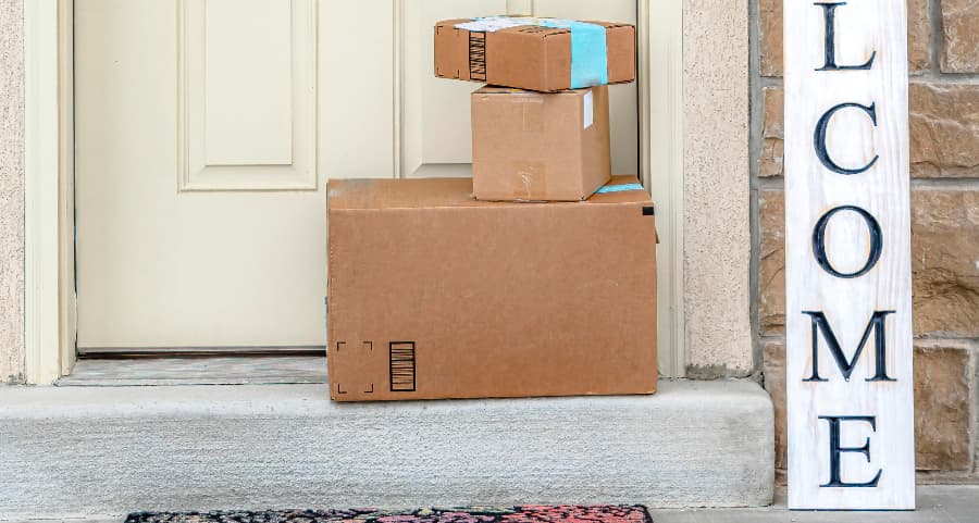 Deliveries on the front porch of a house with a welcome sign in Gaithersburg